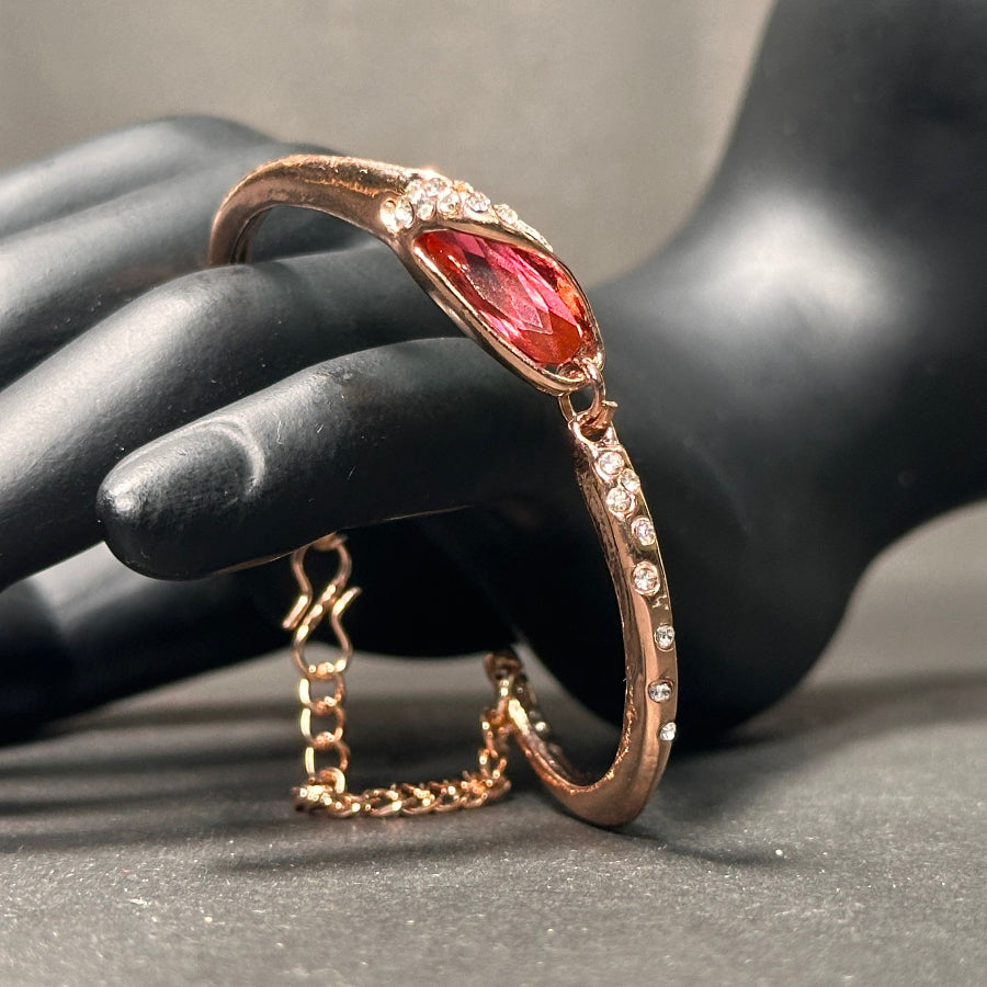 bracelet with a red color stone