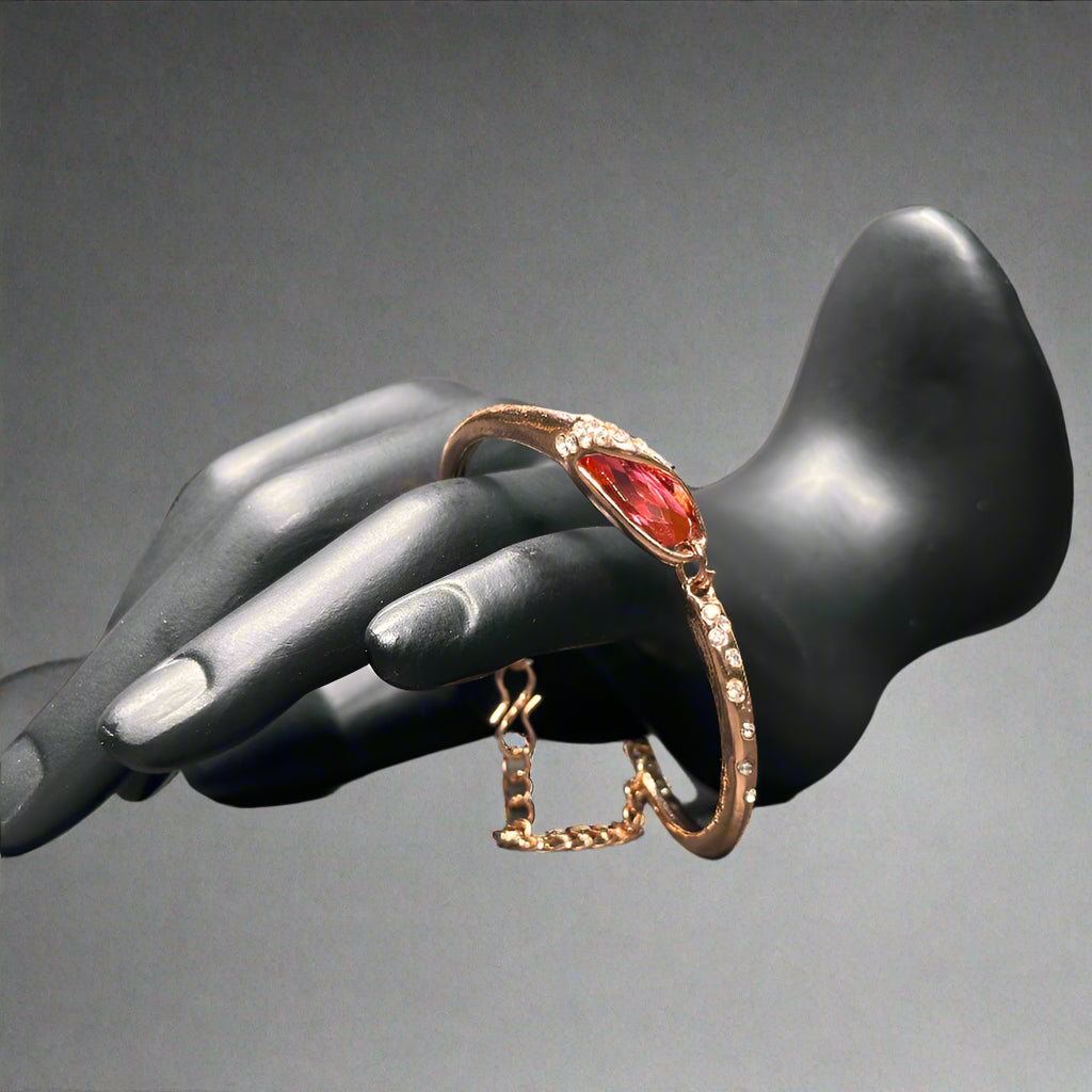 bracelet with a red color stone
