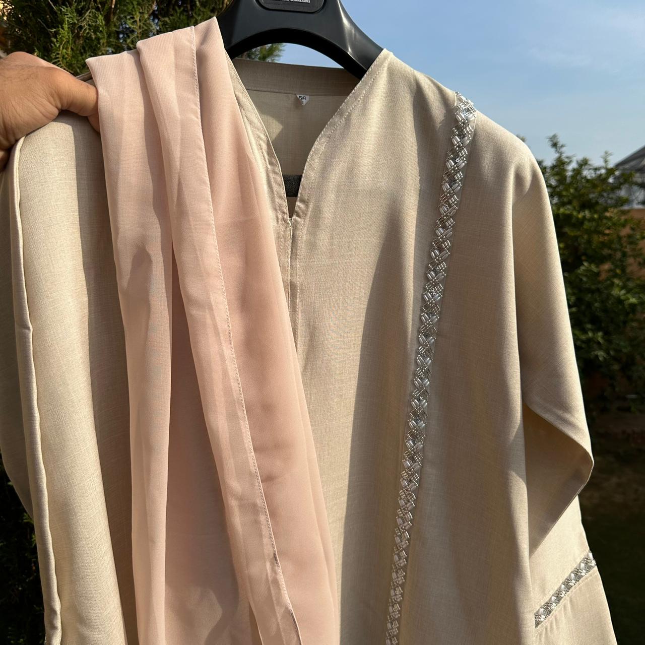 Elegant beige Abaya with pink scarf